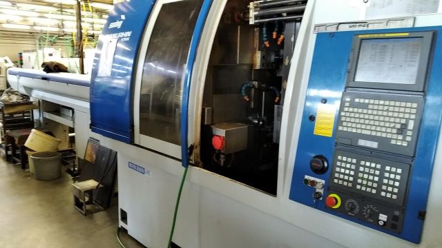 CNC автоматична струг MANURHIN KMX SWING 1032 2006